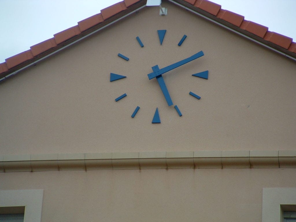 A marker clock that was installed on a building
