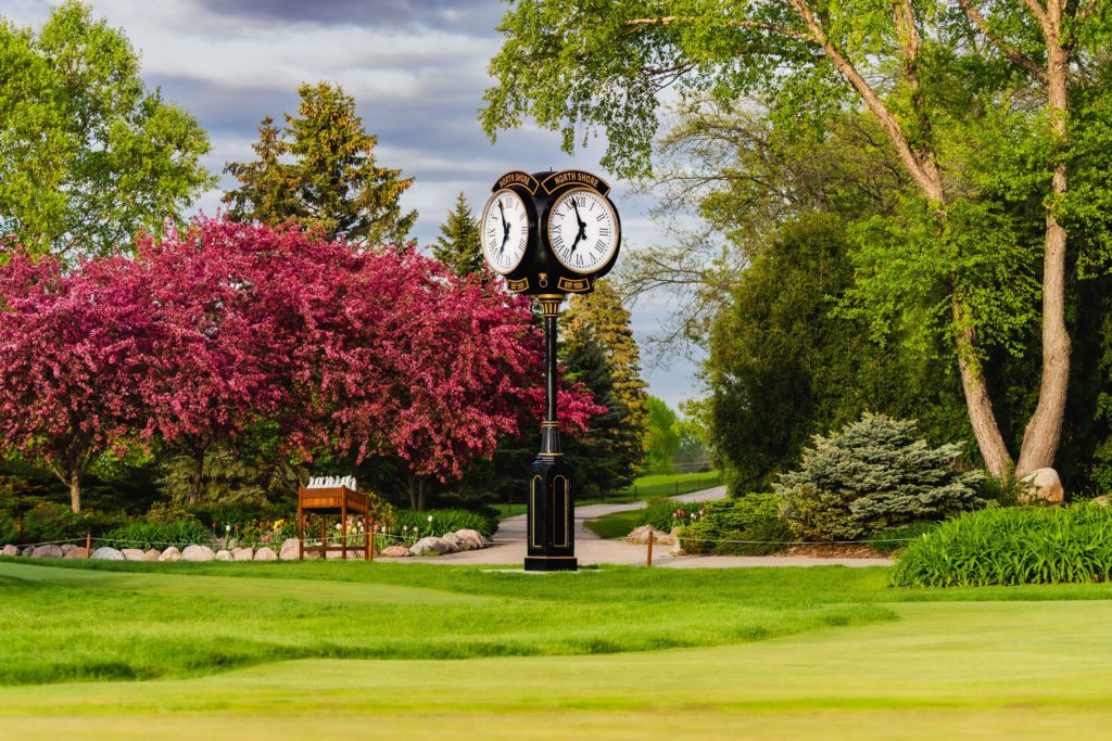 A unique landmark on a Golf Course of a Howard Four Face Replica 16 foot Post Clock in Milwaukee.